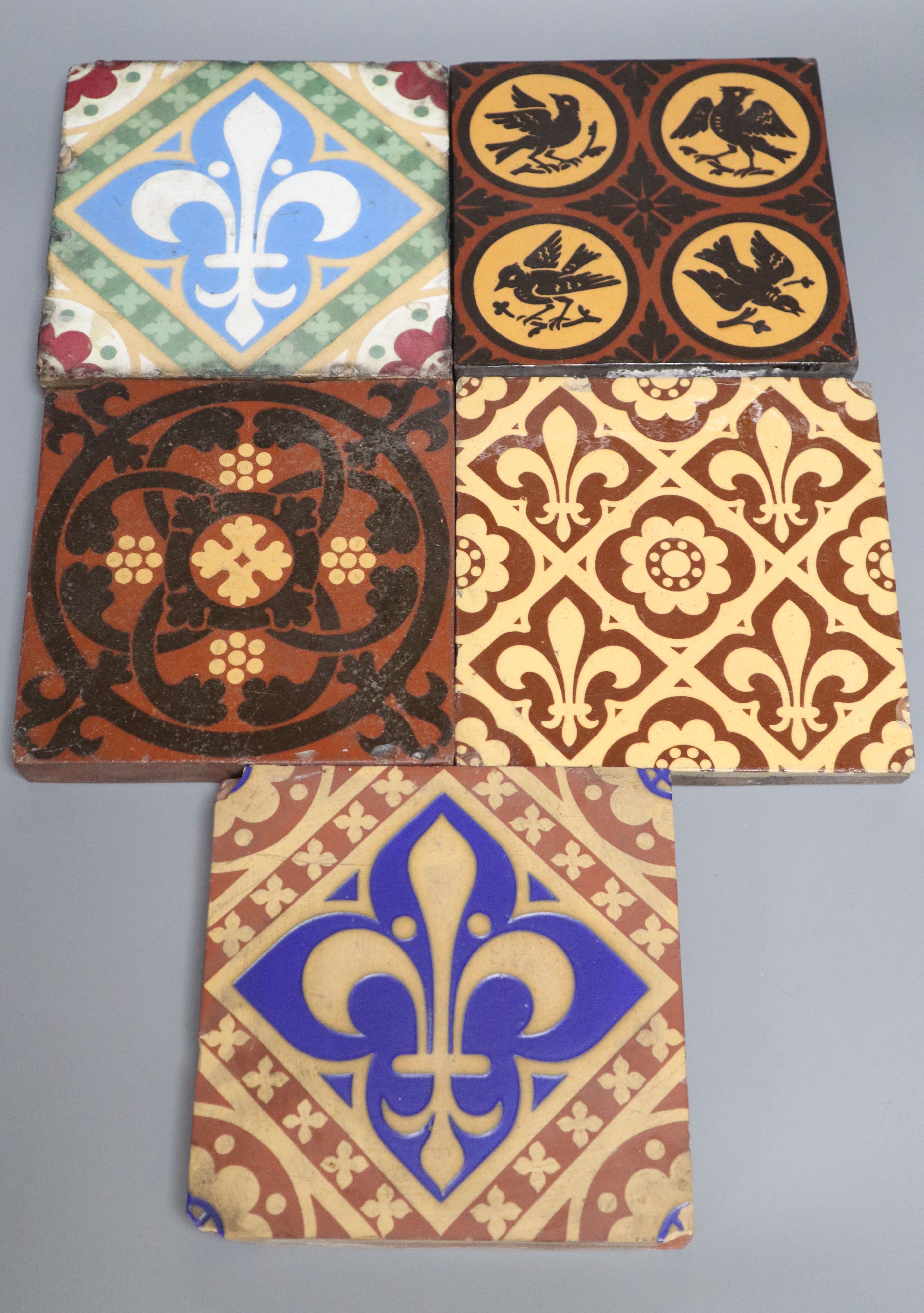 Five encaustic ceramic tiles including A.W.N. Pugin, 15cm, ex Peter Creffield Collection